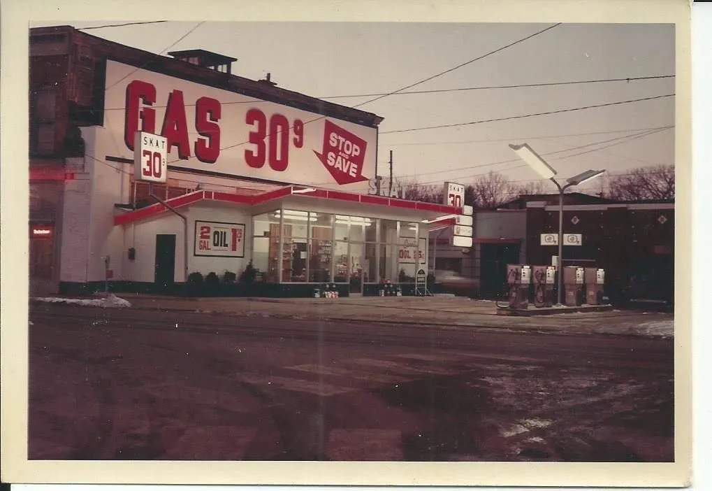 The SKAT station viewed across the road in daylight, the full GAS 30.9 sign spanning the building front.
